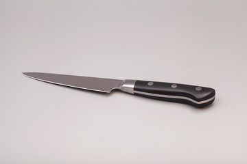 knife over gray background