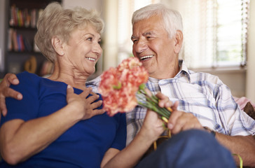 Charming woman is given a bunch of flowers