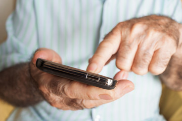 old man using a smartphone