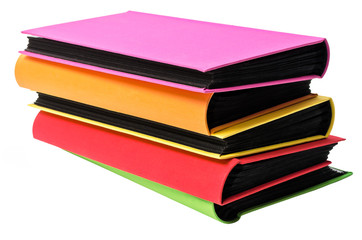 The pile of colored photo albums on wite backround