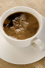 coffee with milk in a white cup