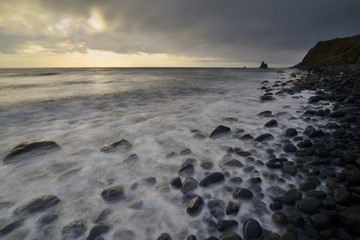 view of the coast of Fajã Grande with the Ilhéu do Monchique in the distance, Flores island, Azores, Portugal