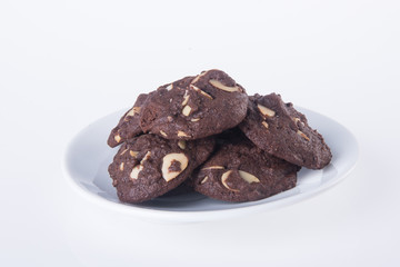 Almonds chocolate chips cookies on background