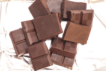 Broken chocolate on a aluminum foil