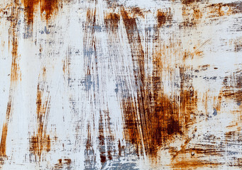 A background of peeling paint and rusty old metal