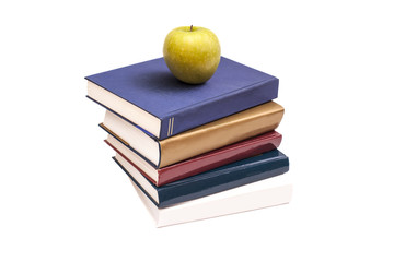 Books and green apple