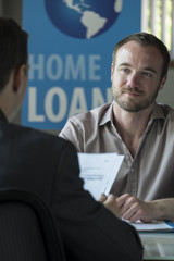 Caucasian male in a home loans office