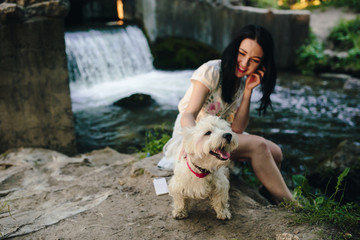 girl playing with a dog