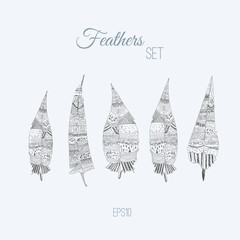 Vector colorful set of doodle tribal feathers. Creative design