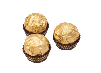 Chocolate balls with almond in gold foil paper