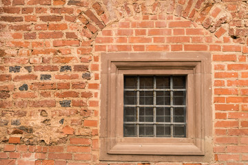 stone wall texture background with small window in the castle