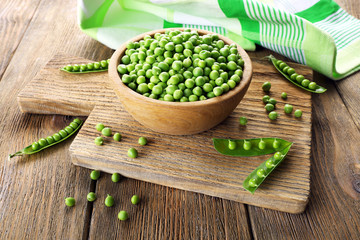 Fresh green peas in bowl on table close up