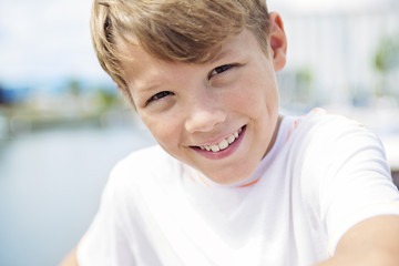 Young teen boy standing on the beach © Louis-Paul Photo