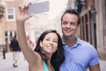 urban couple on a street having fun