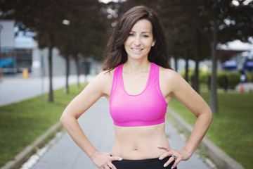 Fototapeta premium woman running outdoors training for marathon run.