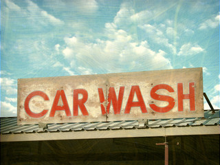 aged and worn vintage photo of car wash sign