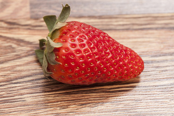 Fresh red strawberries on wooden table