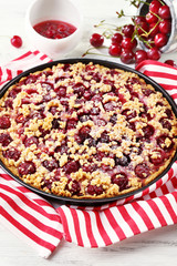 Tasty homemade pie with cherries on table close up