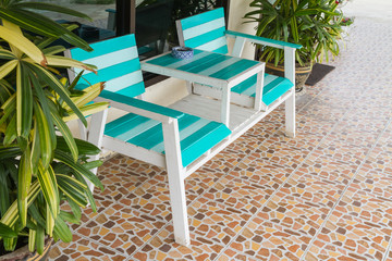 Blue and white chairs in front of the House