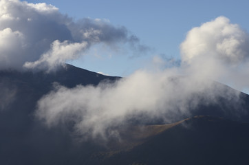Naklejka na ściany i meble Mountains in the clouds