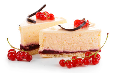 Tasty pieces of cheesecake with berries isolated on white