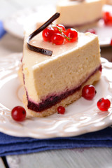 Tasty cheesecake with berries on table close up