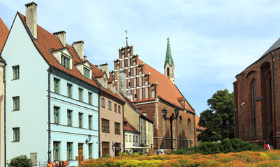 Old houses on the street Skārņu at the foot of St. Peter's Church. Riga, Latvia.