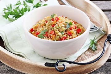 Quinoa salad with vegetables,herbs and lemon. 