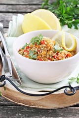 Quinoa salad with vegetables,herbs and lemon. 
