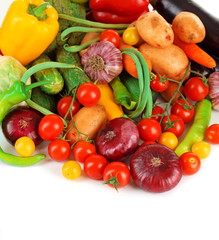 Heap of fresh vegetables isolated on white