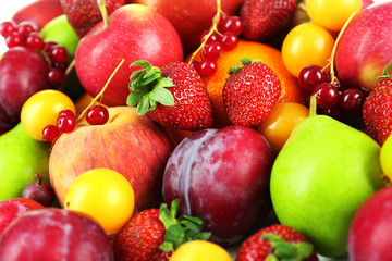 Naklejka na ściany i meble Heap of fresh fruits and berries close up