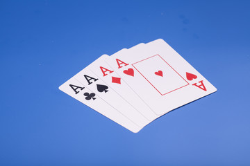 Four aces isolated on blue background