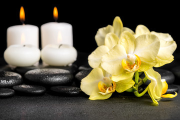 Fototapeta na wymiar beautiful spa still life of yellow orchid phalaenopsis and candl
