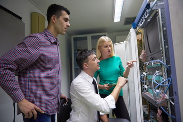 network engeneers working in network server room