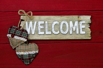 Rustic welcome sign with country fabric hearts