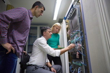 network engeneers working in network server room
