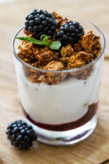 Breakfast - granola, yogurt, berries, wheat