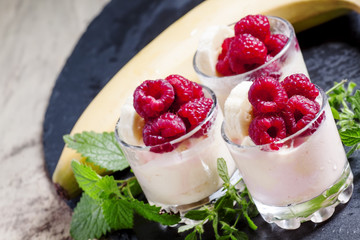 Ice cream with banana and raspberry, selective focus