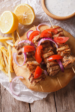 Greek souvlaki with pita close-up. vertical view from above
