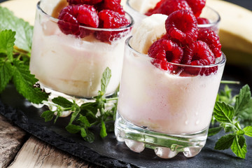 Ice cream with banana and raspberry, selective focus