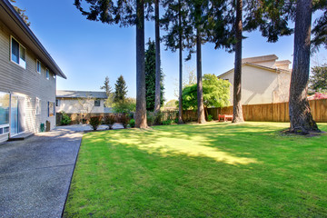 Lovely and large back yard of home with patio.