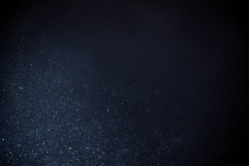Fototapeta premium abstract dark bokeh lights background , defocused background, glowing galaxy
