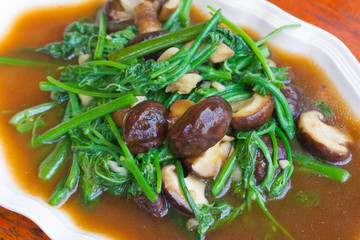 Fried Chayote vegetable in oyster sauce with shiitake