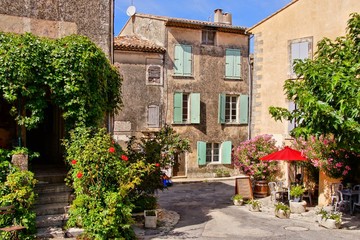 Beautiful stone houses on a street in a quaint village in Provence, France