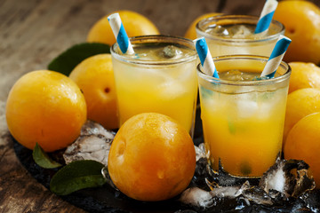 Plum smoothie with ice and straws striped, selective focus