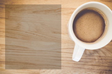 hot chocolate in a white porcelain cup on a natural wood background
