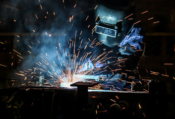 people welding industry