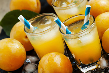 Plum smoothie with ice and straws striped, selective focus