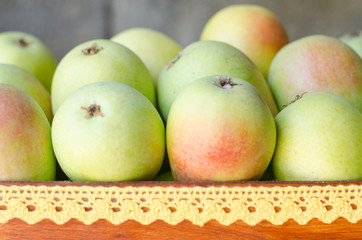 Wooden box full of ripe pears.