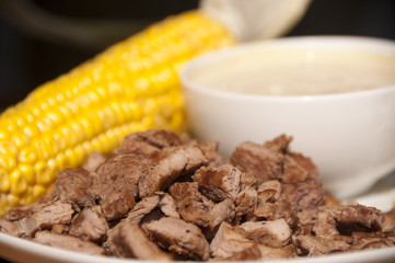 Lunch with corn and roasted meat